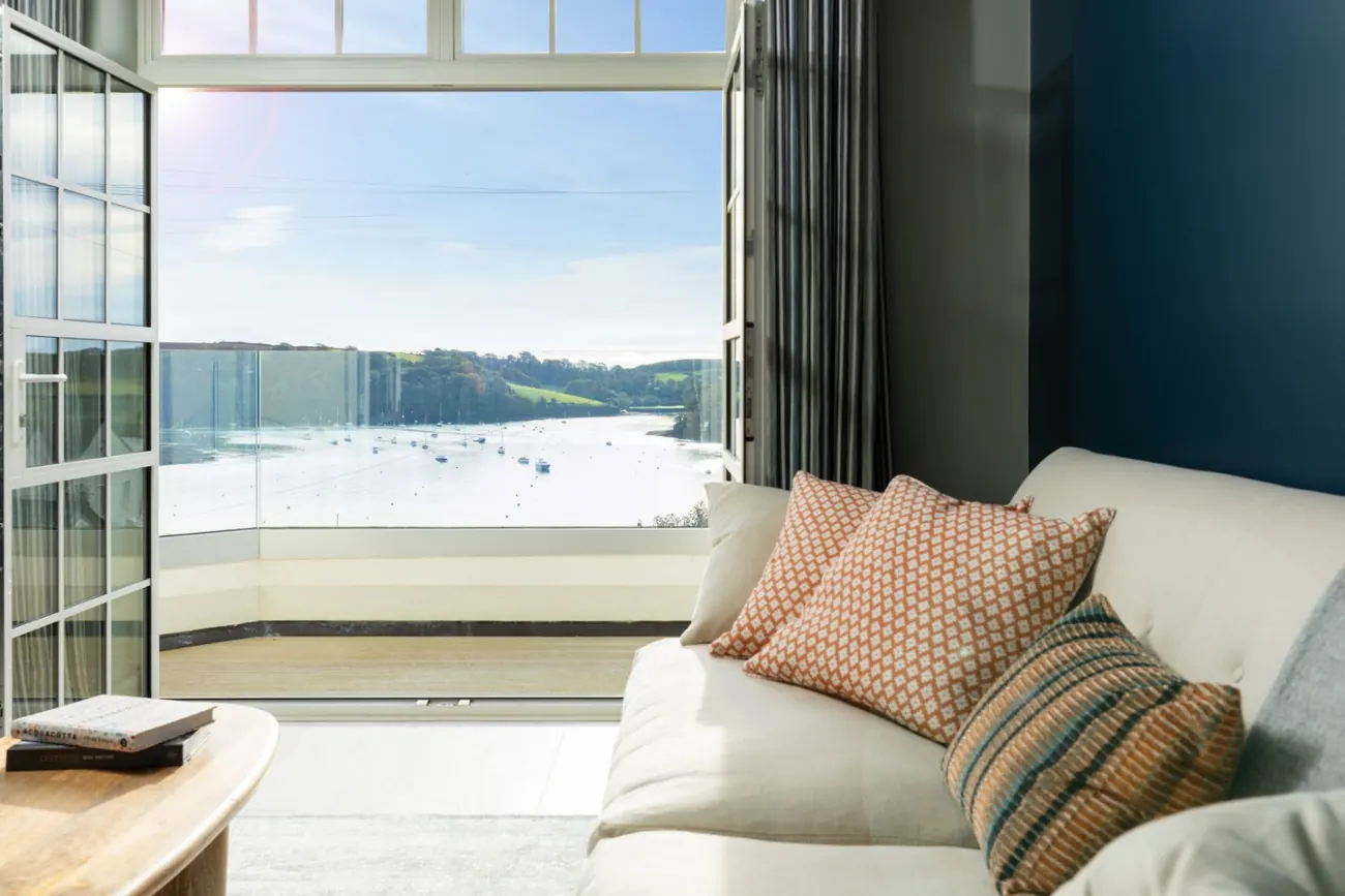 Balcony off the sitting room, with open doors looking over the moorings