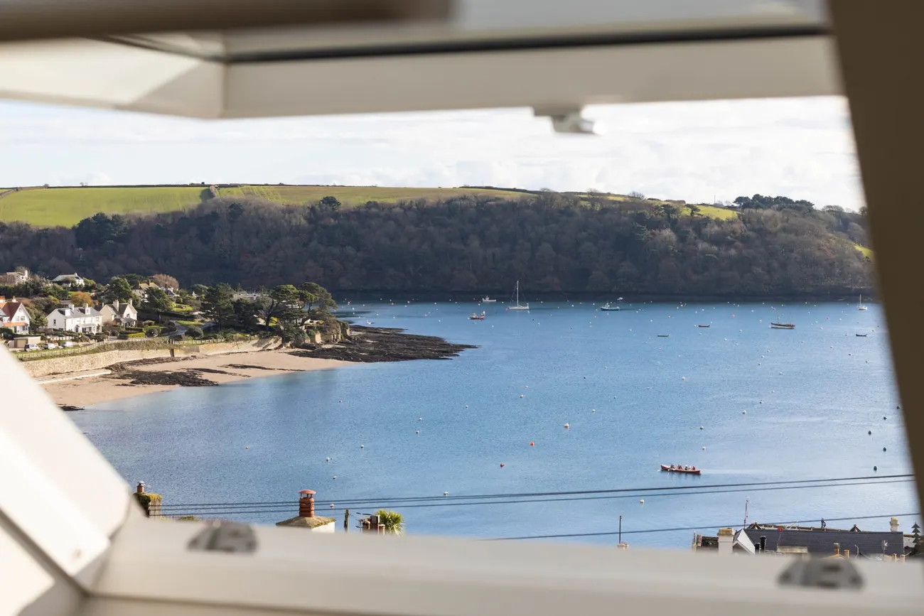The view from the main bedroom window at No.9, looking out over the beach, the moorings and the wooded far bank